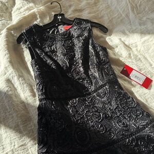 Never been worn Carmen Marc Valvo, size 4